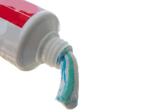 Toothpaste squeezed out of the tube isolated on white