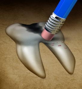 Tooth repair dental health medical concept with a large cavity being erased by a pencil eraser as a metaphor for dentist services to fix damaged teeth problems.