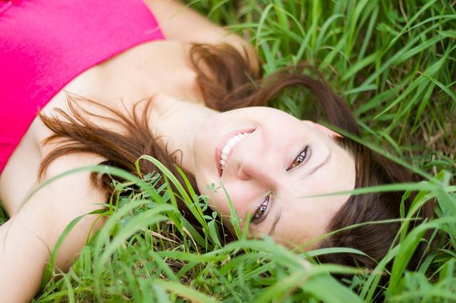 Woman smiling in the grass