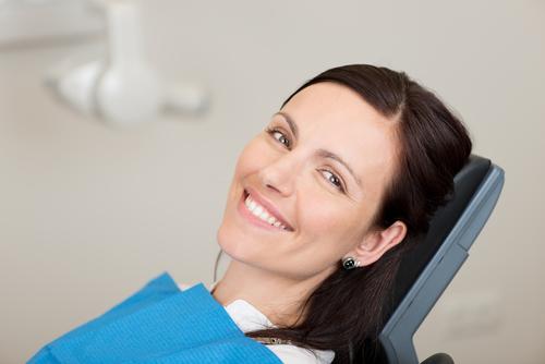 Smiling woman in dentist chair