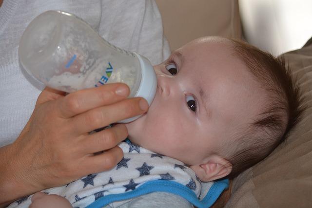 Baby drinking from a baby bottle