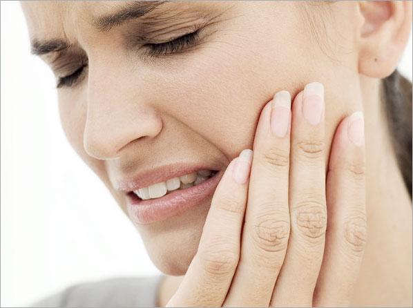 Woman with sensitive teeth