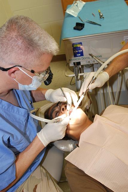 Dentist workin on a man's teeth