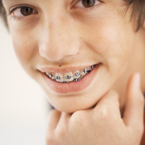Front view of boy wearing braces