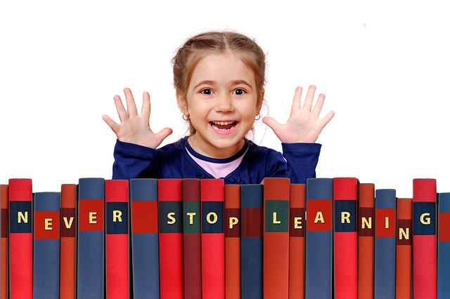 Little Girl Smiling with her hands up