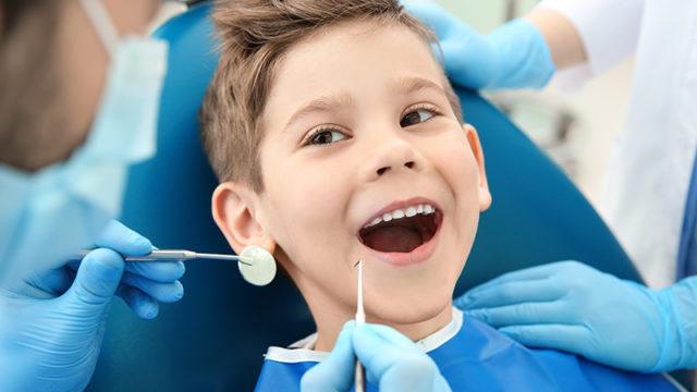 Cute kid in dentist clinic