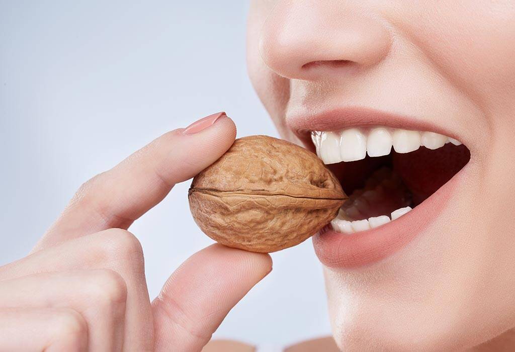 Woman Biting Walnut