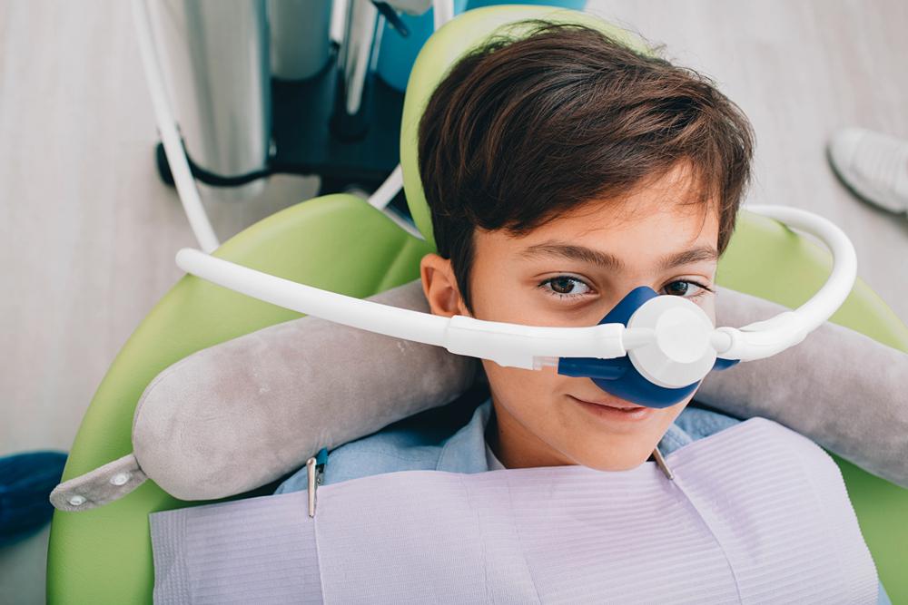 Kid using laughing gas