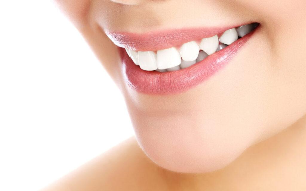 Young smiling woman, white background,