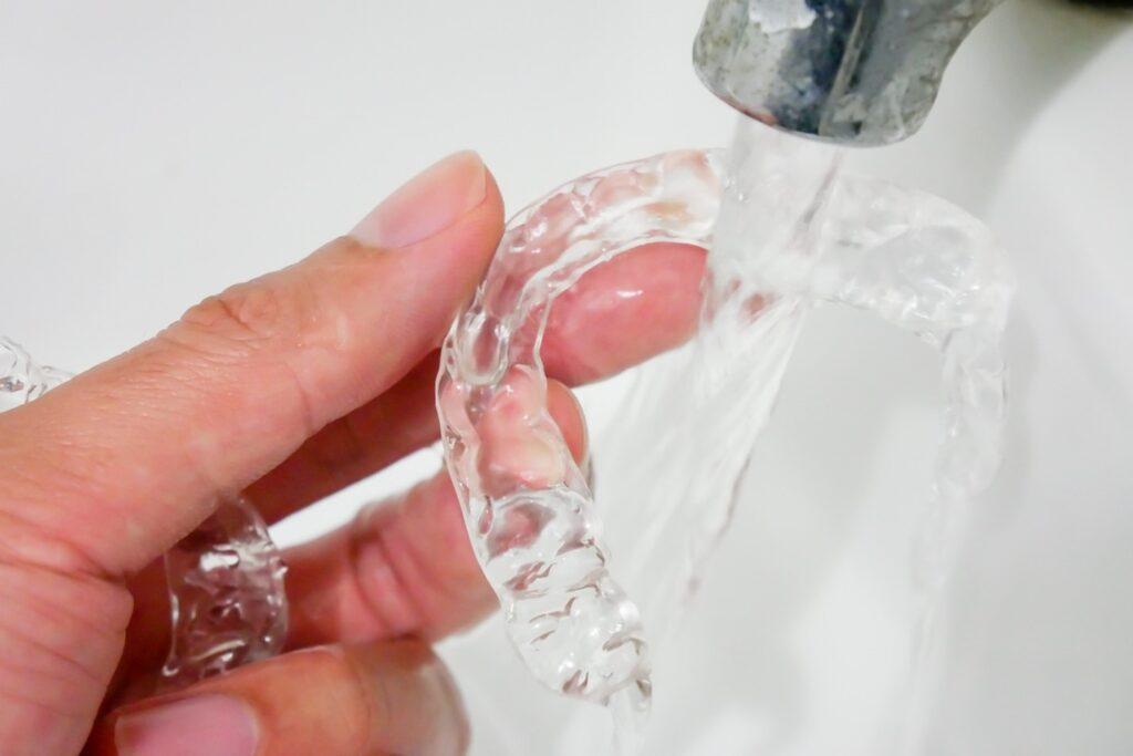 Hand Rinsing SureSmile Aligners