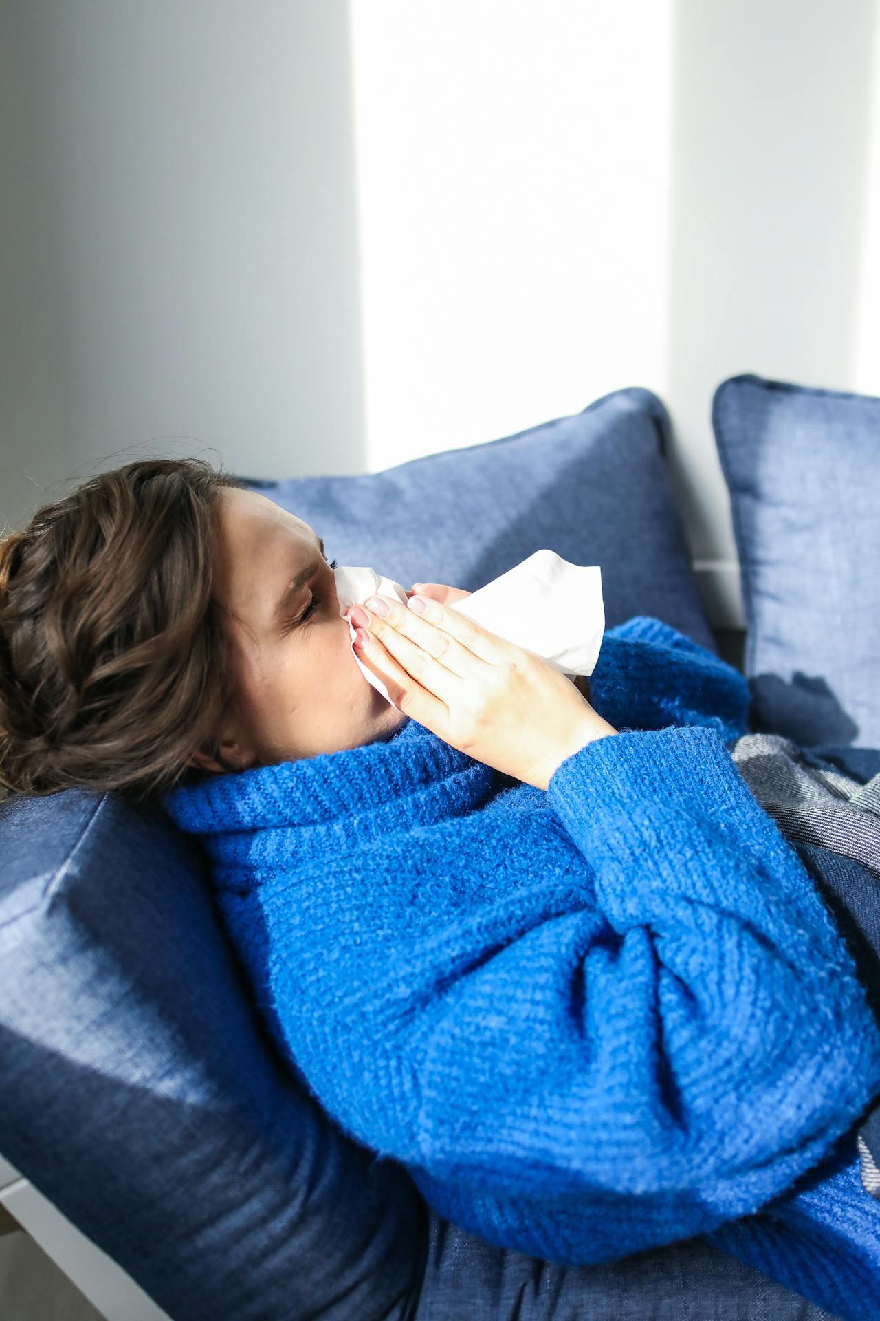 Woman wiping her runny nose