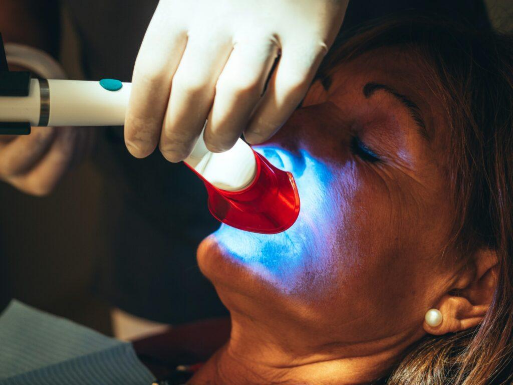 Caucasian Patient Goes To Dentist's Office For Teeth Whitening