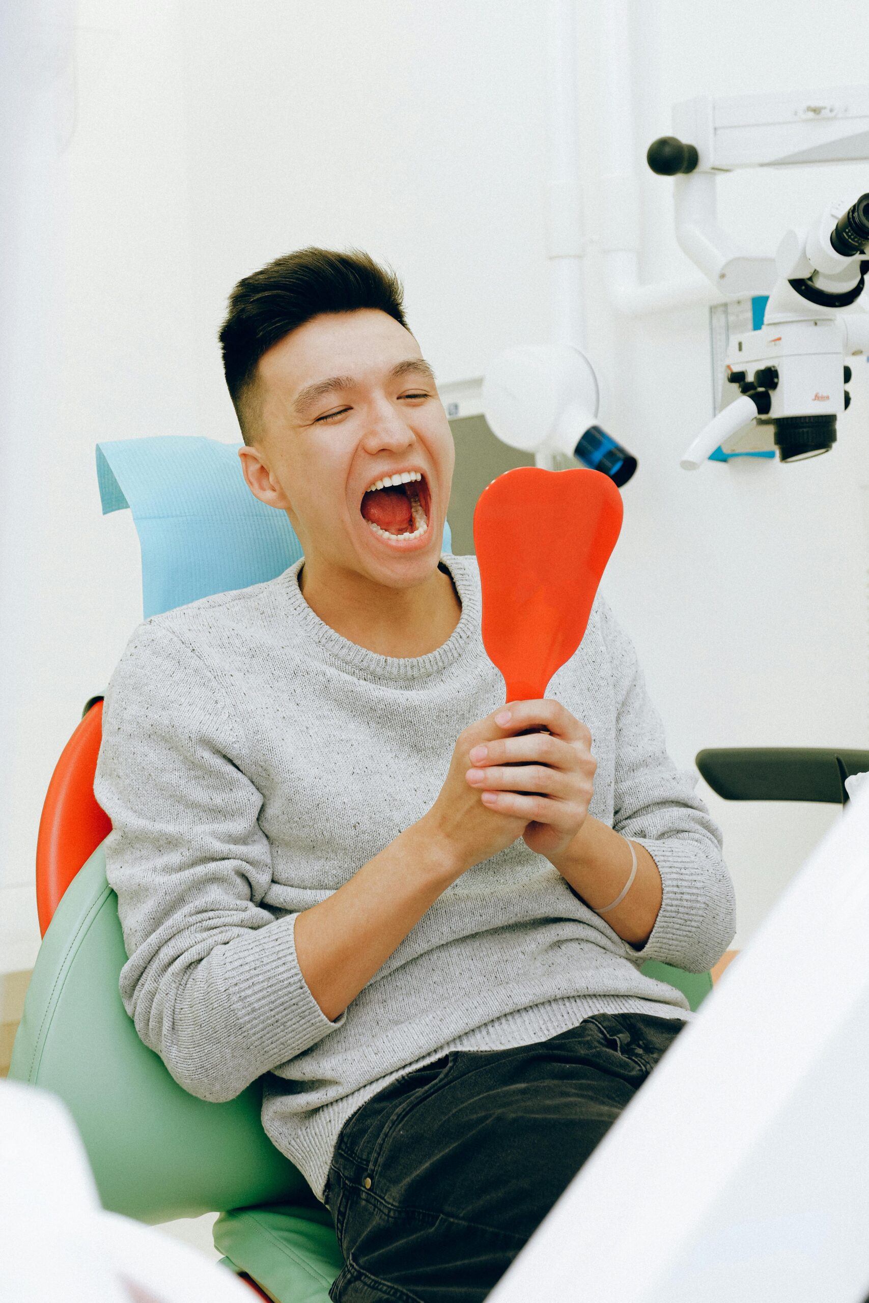 Metal-Free Fillings 2 Dental Patient admiring is natural colored fillings