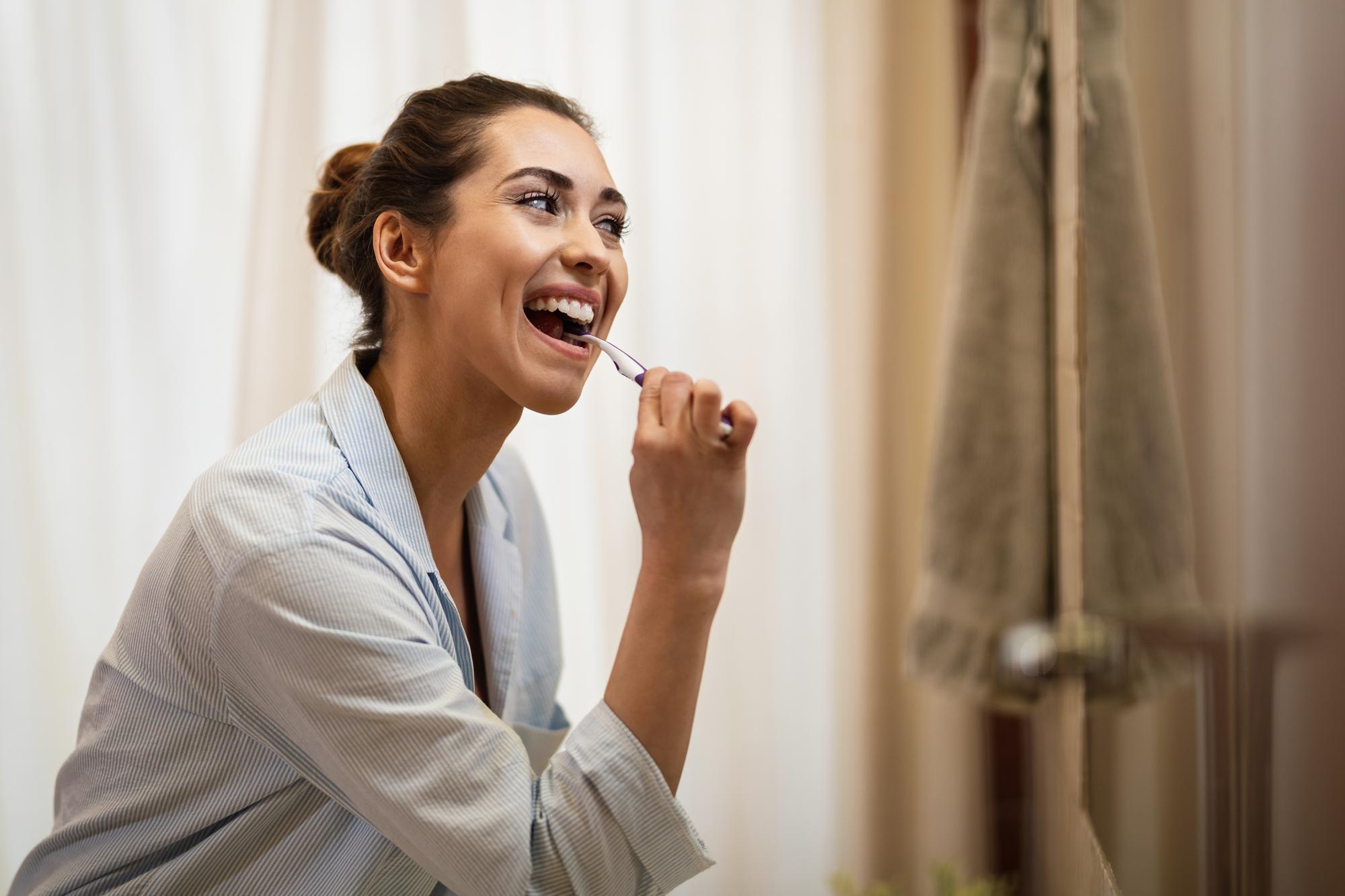 Orem resident practicing good oral hygiene to prevent dental emergencies