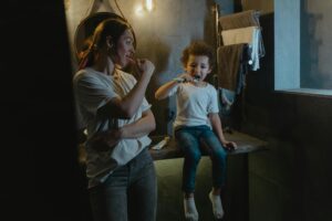 Mother and Son Brushing Their Teeth