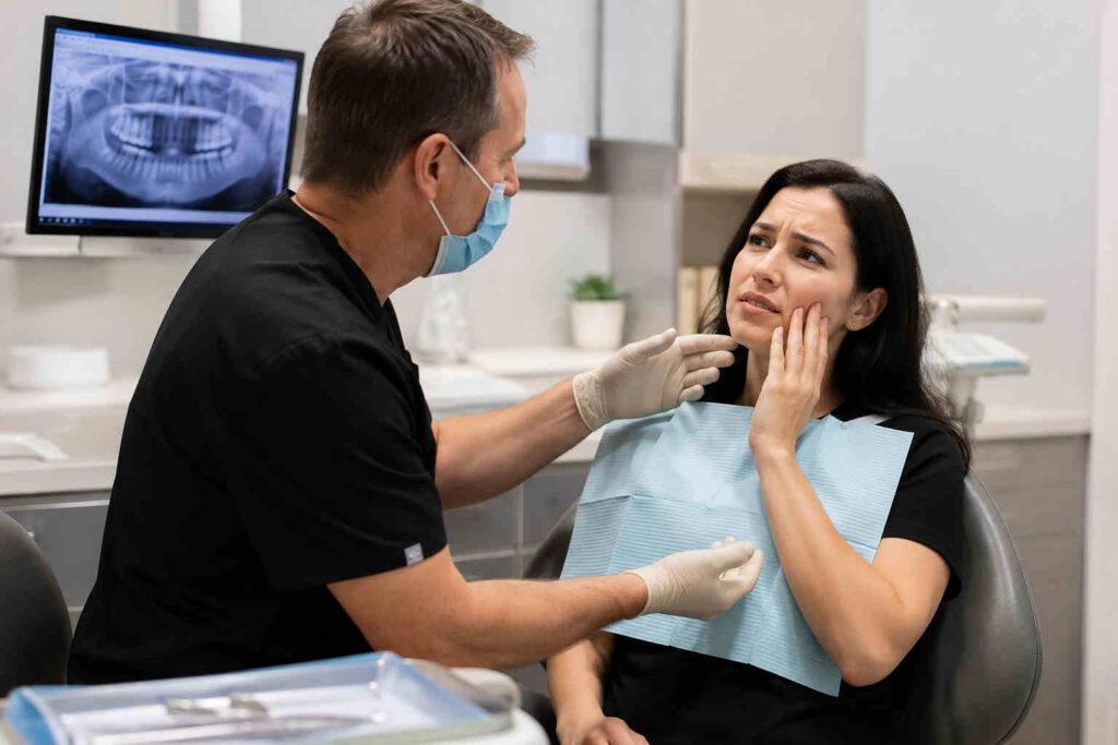 Is Unbearable Tooth Pain an Emergency? When to See an Emergency Dentist in Orem, Utah 1 Emergency dentist treating a patient with tooth pain in Orem Utah